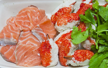 Raw salmon fish and claw crab