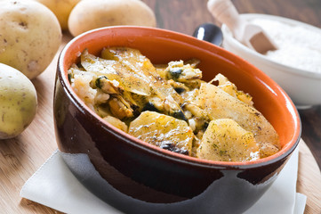 Tiella of potatoes, rice and mussels.