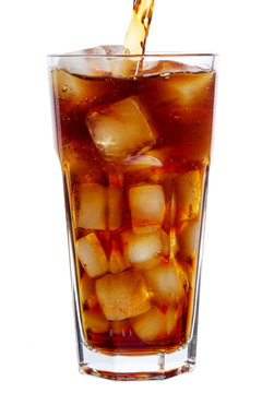 Cola pouring into a glass isolated on white