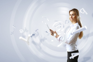 Woman in business wear with technology background