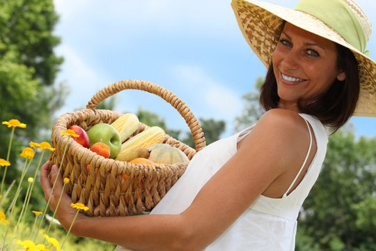 Woman With Basket Of Fruit