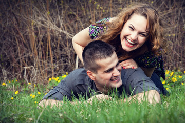 Happy couple having fun on grass