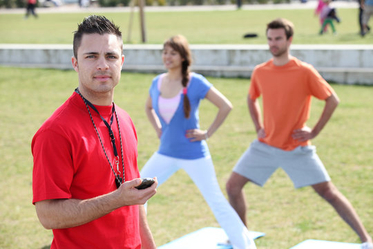 Personal trainer with his clients