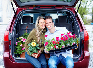 Happy couple with flowers.
