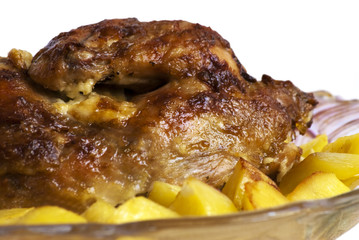 Roast chicken with potatoes, isolated on white background