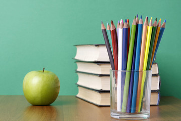 School books with apple
