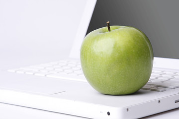 An apple on a laptop