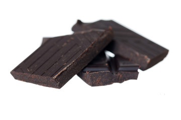 Pile of Dark Chocolate on White Background.