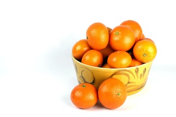 Oranges arranged in an Orange coloured bowl