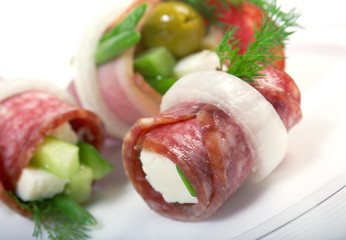 Canape platter with cheese, smoked sausage