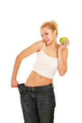 young girl with big jeans and apple