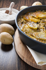 Tiella of potatoes, rice and mussels.