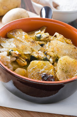 Tiella of potatoes, rice and mussels.
