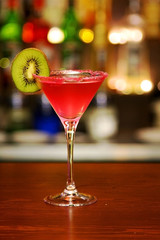 Red cocktail with kiwi