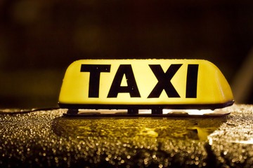 Taxi sign in rainy day