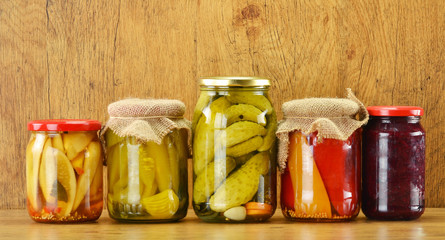 Composition with jars of pickled vegetables