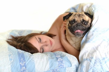 woman with dog in bed