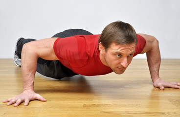 man doing pushup fitness exercise