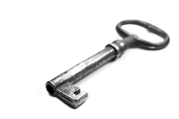 Old key on a white background