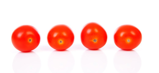 Four cherry tomatoes in a row