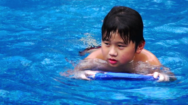 chubby boy swimming
