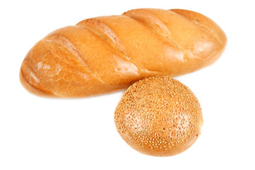Sliced bread and bun with sesame seeds