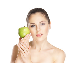 Portrait of a young woman holding a fresh green apple