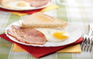 Breakfast. Eggs, toasts and bacon