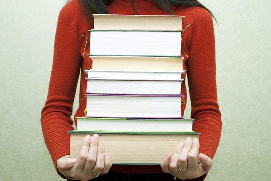 The woman with books in hands