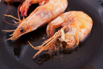 shrimp and sweet sauce on black plate