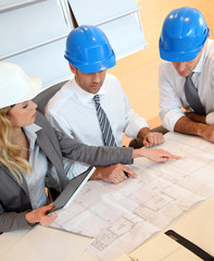 Architects and businesswomen working on construction project