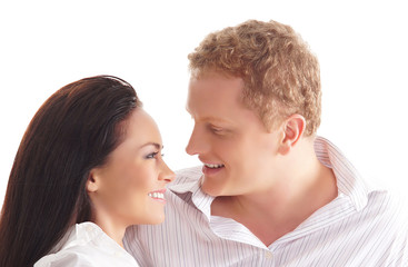 A young and happy couple on a white background