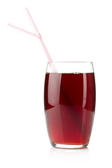 Pomegranate juice in a glass with two drinking straws
