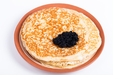 Pancakes with black caviar