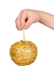 golden apple toy in child hand