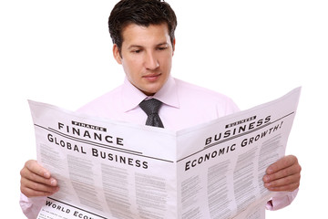 A businessman reading a newspaper