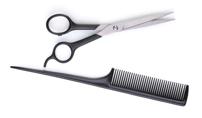 Hair cutting shears and comb isolated on white