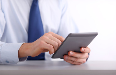 Young adult working on a digital tablet