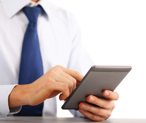 Handsome businessman using computer plane-table