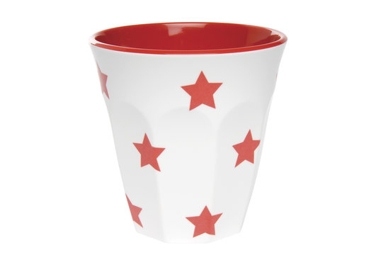 Cup with star pattern on white. Clipping path included.