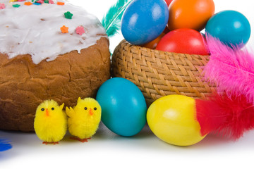 Fototapeta na wymiar Easter eggs, cake and chickens