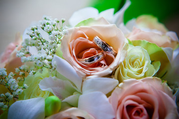 Wedding rings on a bouquet.