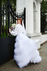 Happy bride in park