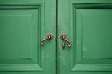 Door handles with an old double wood door