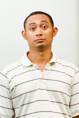 asian young man with questioning face expression