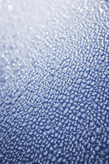 water droplets on blue car background