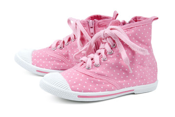 Pink shoes with dots on a white background.