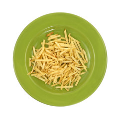 Green plate with shoestring potatoes