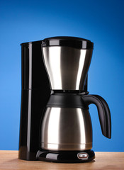 Coffee maker on blue background