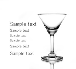 Empty glass of martini  on white background sharp light and refl